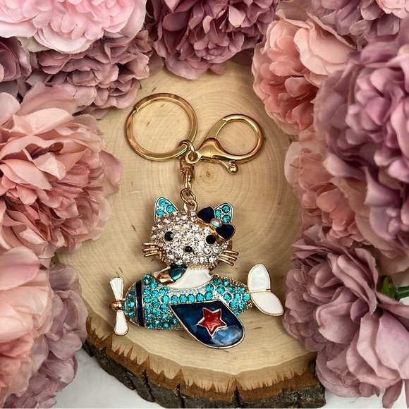 Hello Kitty Flying a Bkue Crystal Airplane Keychain Charm - Picture 8 of 16